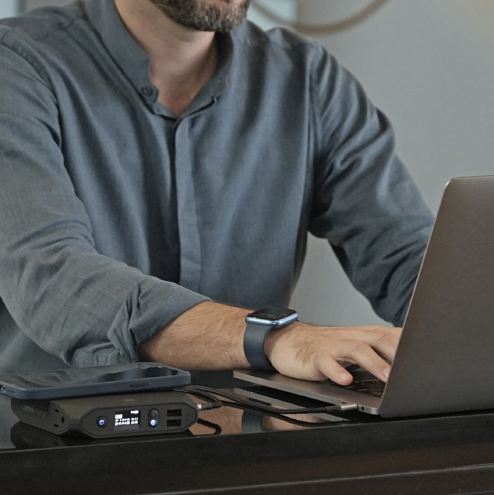 Student using a laptop powered by an Omni power bank